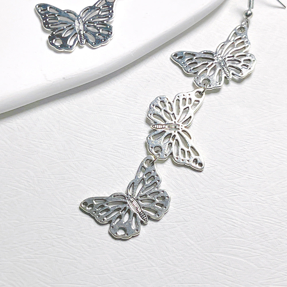 lindos aretes colgantes de metal con forma de mariposa