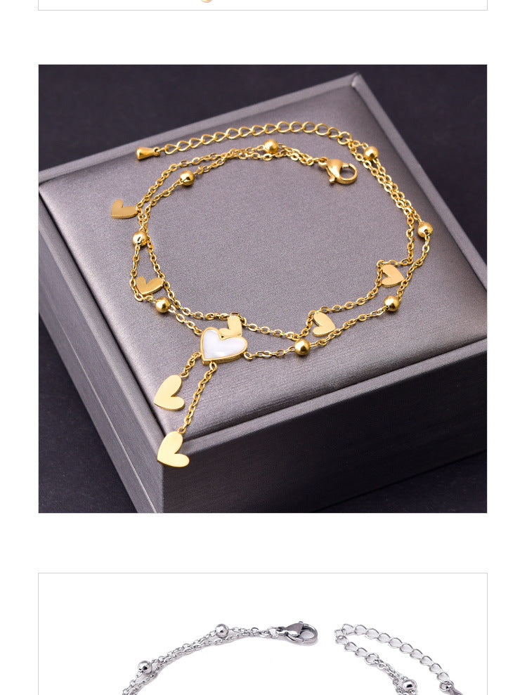 Tobillera de mujer con incrustaciones de acero y titanio con forma de corazón dulce