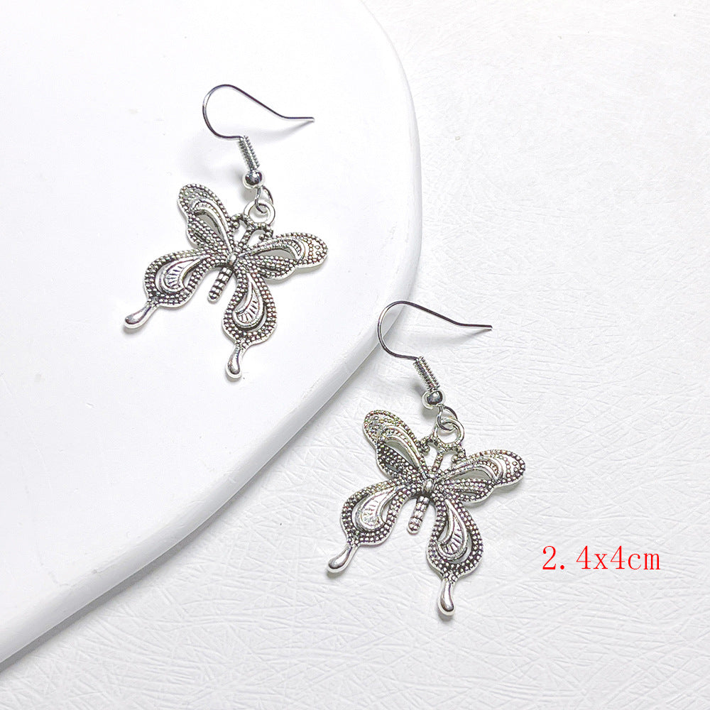 lindos aretes colgantes de metal con forma de mariposa