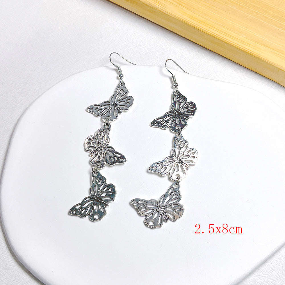 lindos aretes colgantes de metal con forma de mariposa