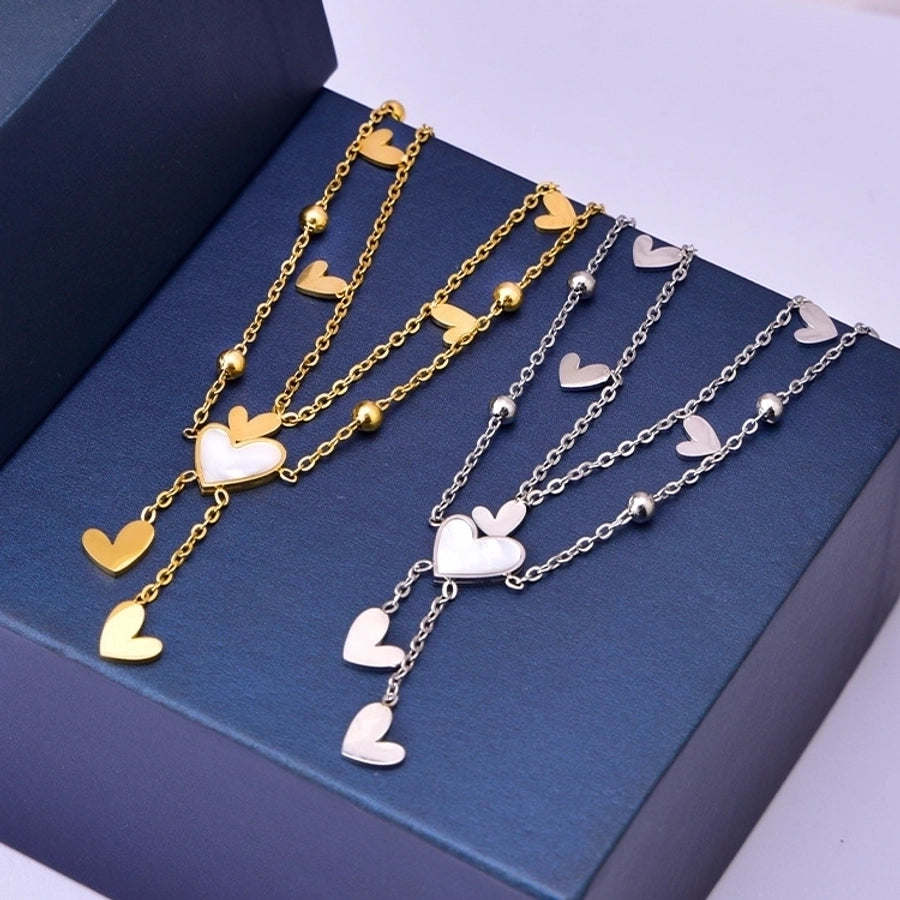 Tobillera de mujer con incrustaciones de acero y titanio con forma de corazón dulce