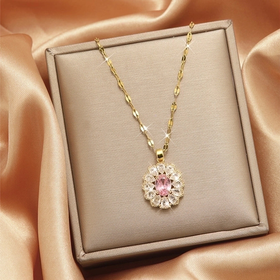 Collar con colgante chapado en oro con incrustaciones de acero de titanio y flor en forma de corazón
