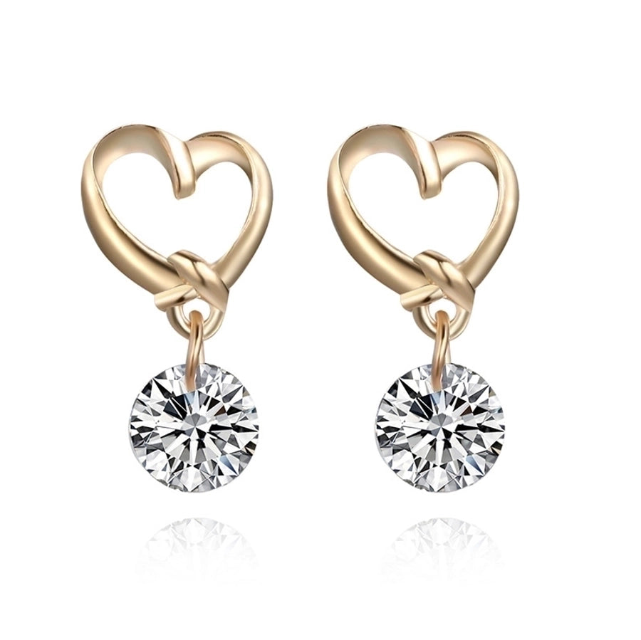 Pendientes colgantes de hojas asimétricas con corazón de cristal