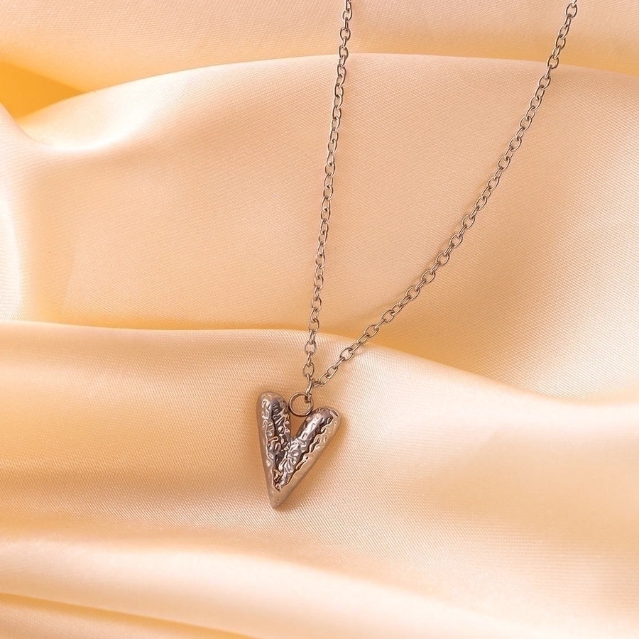 Pendientes de aro chapados en oro de 18K con forma de corazón de pentagrama de estilo clásico lindo e informal ahuecados Acero inoxidable 304 Acero de titanio