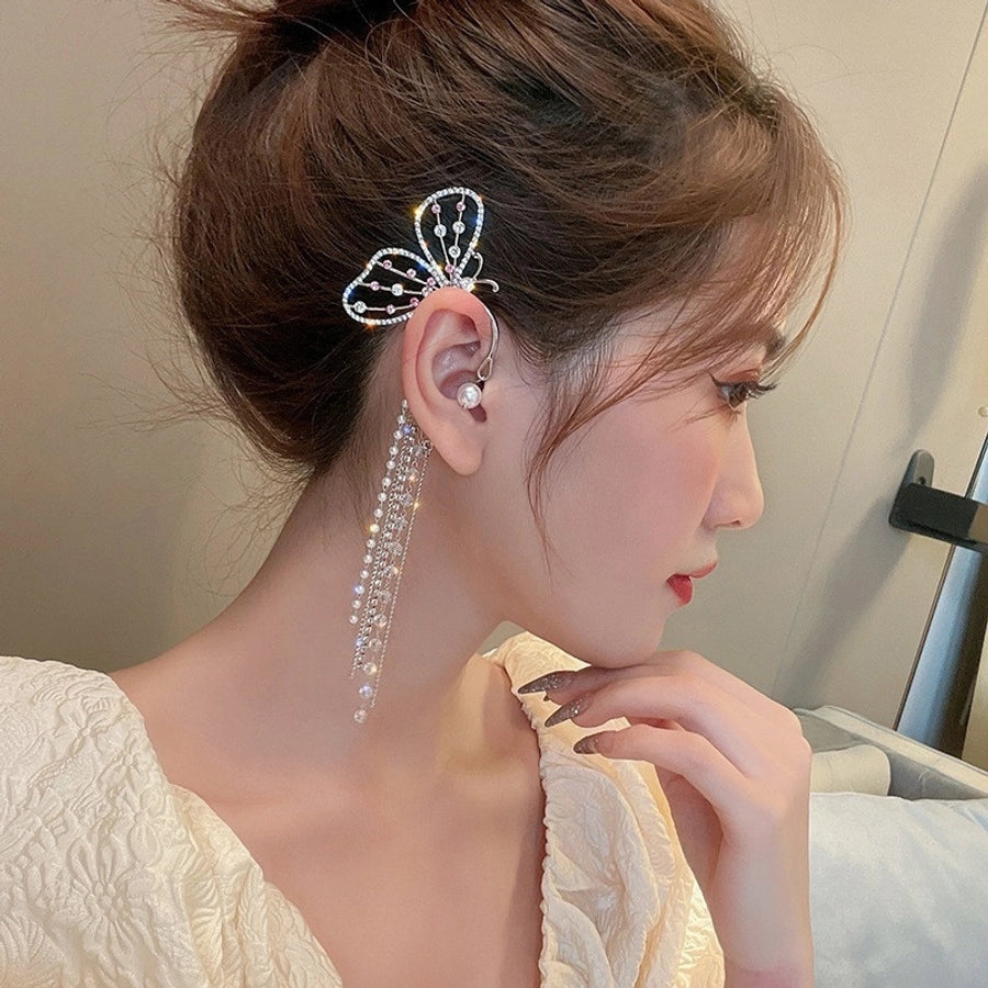 Clips para las orejas con incrustaciones de diamantes artificiales de aleación de mariposa estilo Hada de joyería