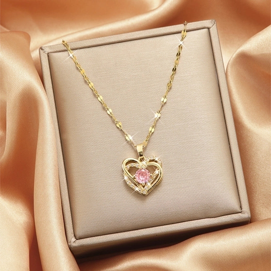 Collar con colgante chapado en oro con incrustaciones de acero de titanio y flor en forma de corazón