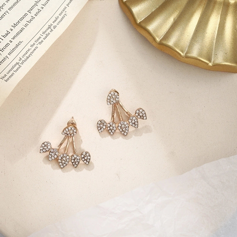 Pendientes colgantes de hojas asimétricas con corazón de cristal