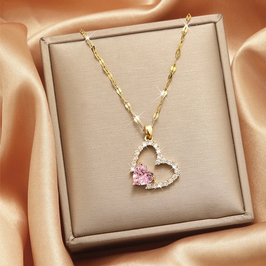 Collar con colgante chapado en oro con incrustaciones de acero de titanio y flor en forma de corazón