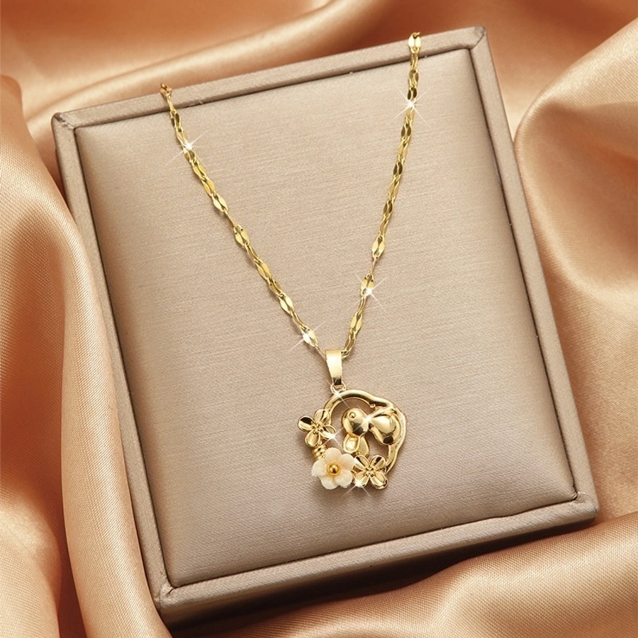 Collar con colgante chapado en oro con incrustaciones de acero de titanio y flor en forma de corazón