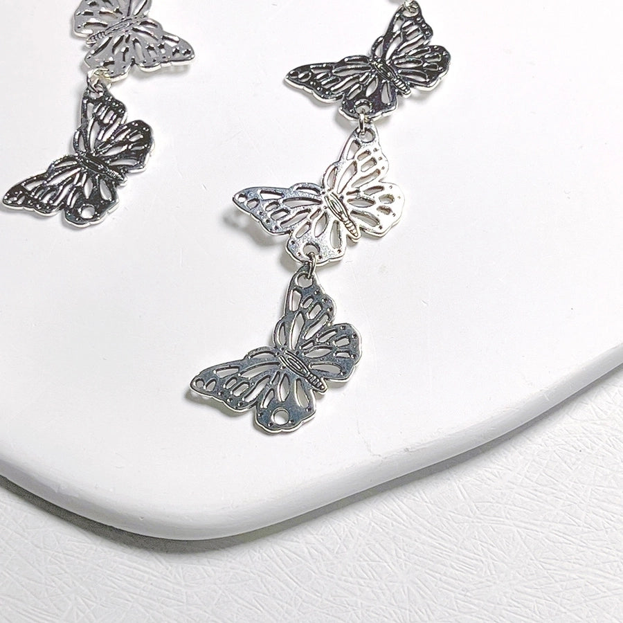 lindos aretes colgantes de metal con forma de mariposa