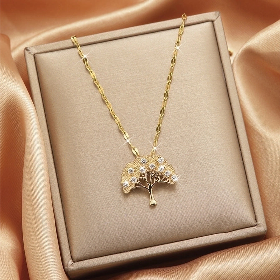 Collar con colgante chapado en oro con incrustaciones de acero de titanio y flor en forma de corazón