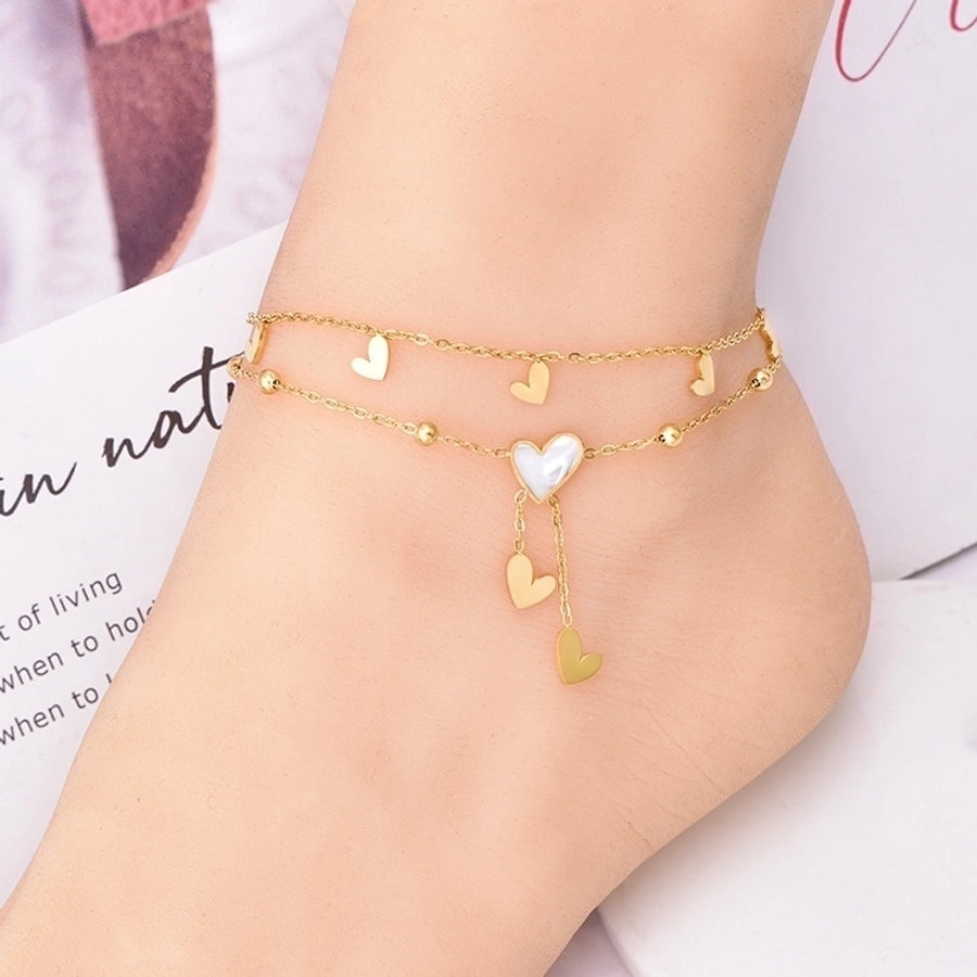 Tobillera de mujer con incrustaciones de acero y titanio con forma de corazón dulce