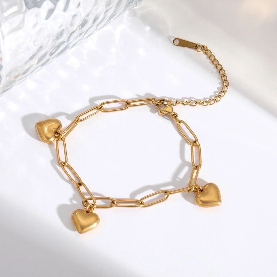 Pendientes de aro chapados en oro de 18K con forma de corazón de pentagrama de estilo clásico lindo e informal ahuecados Acero inoxidable 304 Acero de titanio
