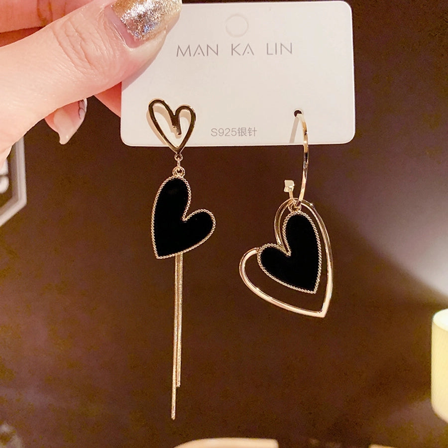 Pendientes de amor con borlas asimétricas