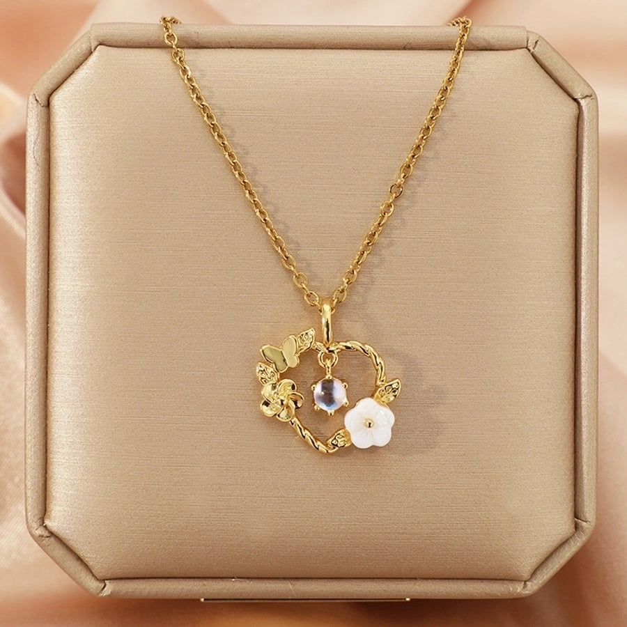 Collar con colgante chapado en oro con incrustaciones de acero de titanio y flor en forma de corazón