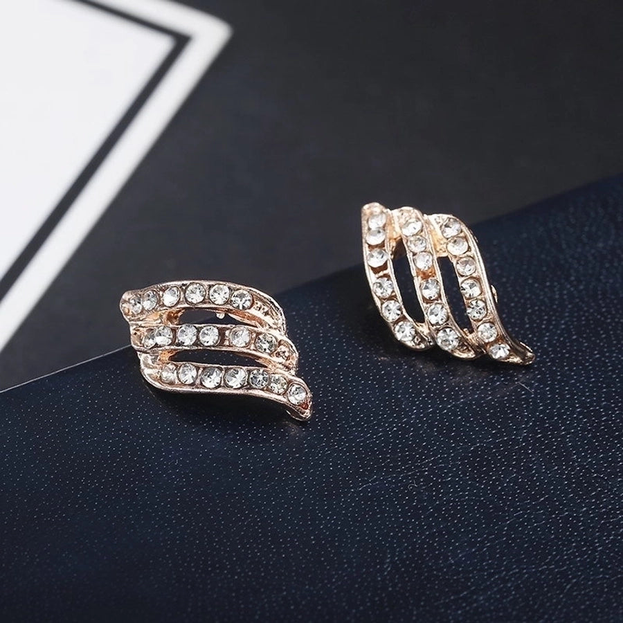 Pendientes colgantes de hojas asimétricas con corazón de cristal