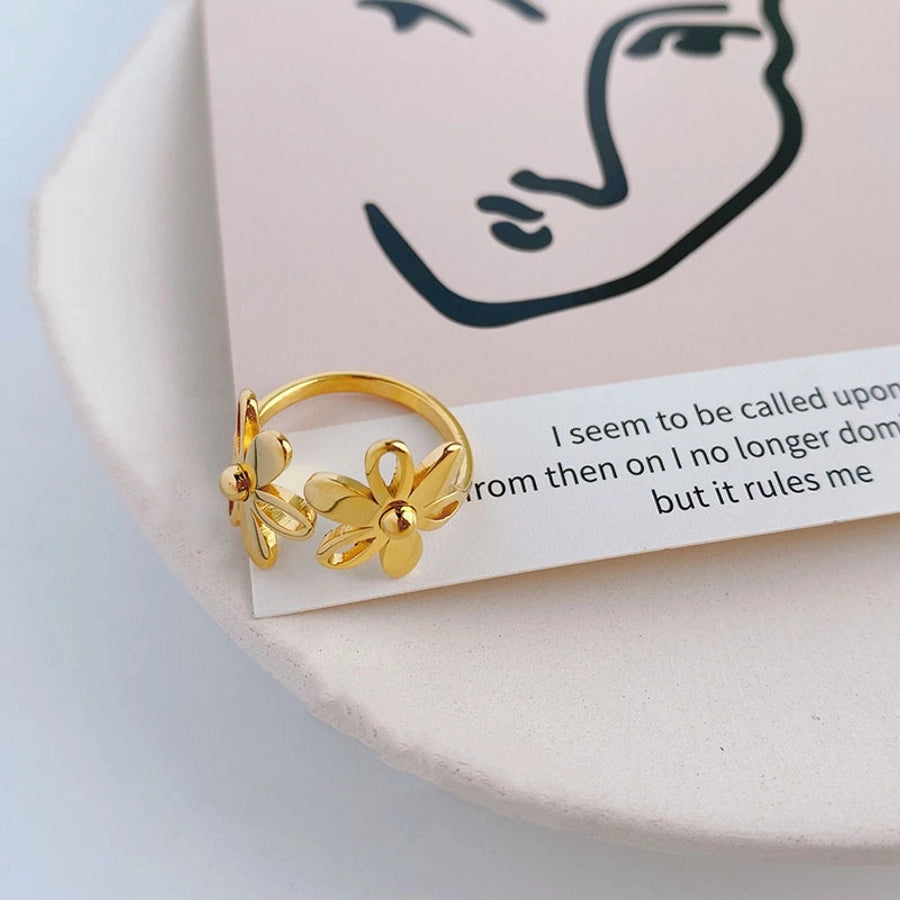 Anillos de acero de titanio con flor pulida linda chapada en oro de 18K