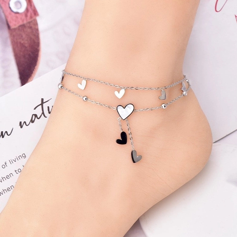Tobillera de mujer con incrustaciones de acero y titanio con forma de corazón dulce