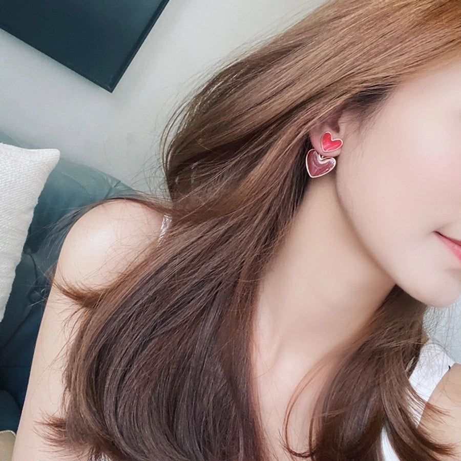 Pendientes colgantes de mujer esmaltados de aleación con forma de corazón lindo