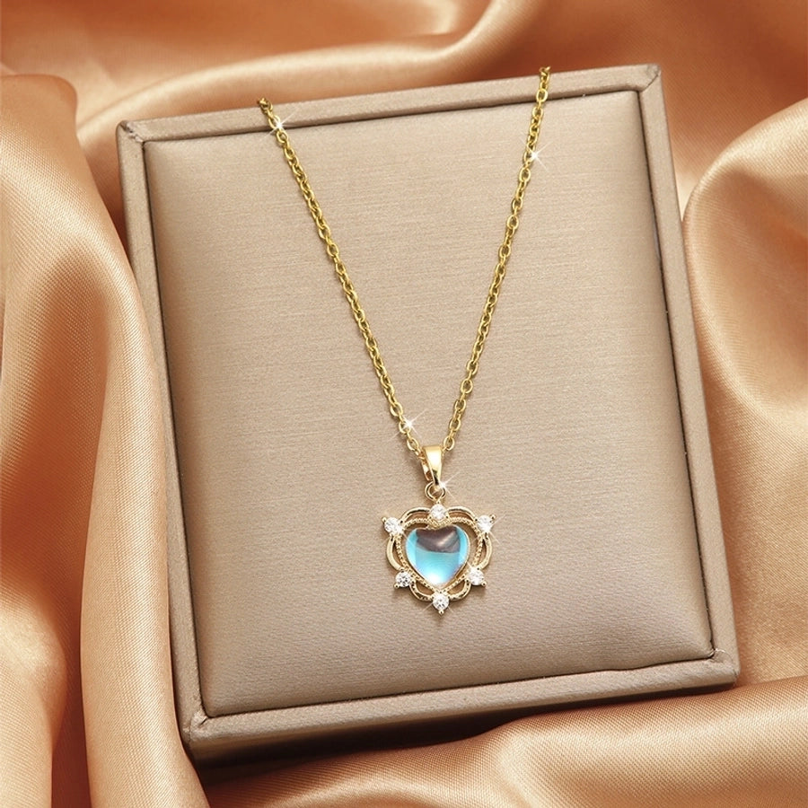 Collar con colgante chapado en oro con incrustaciones de acero de titanio y flor en forma de corazón