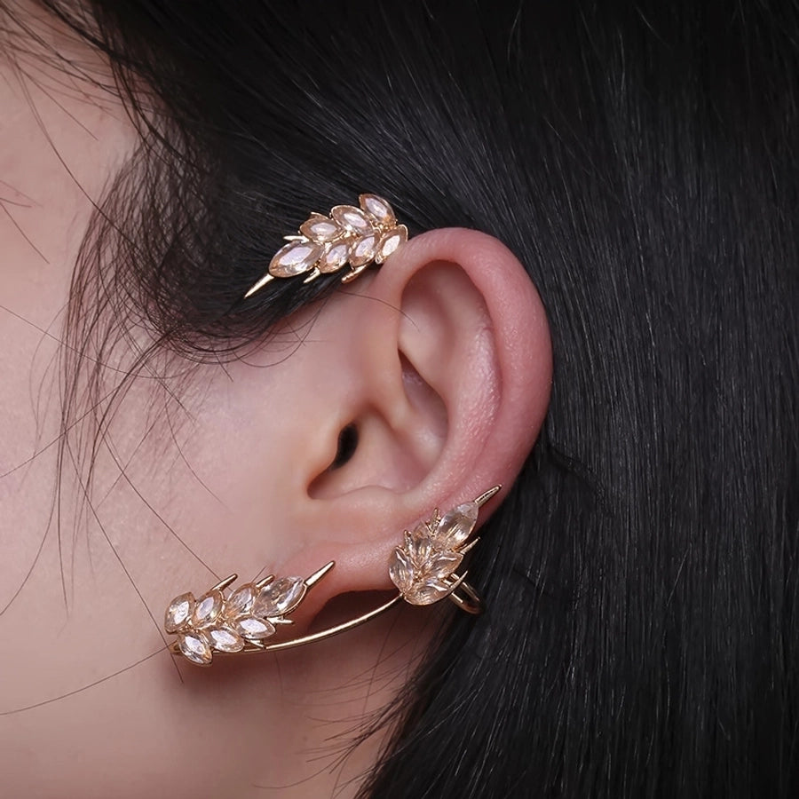 Clips para las orejas con incrustaciones de diamantes artificiales de aleación de mariposa estilo Hada de joyería