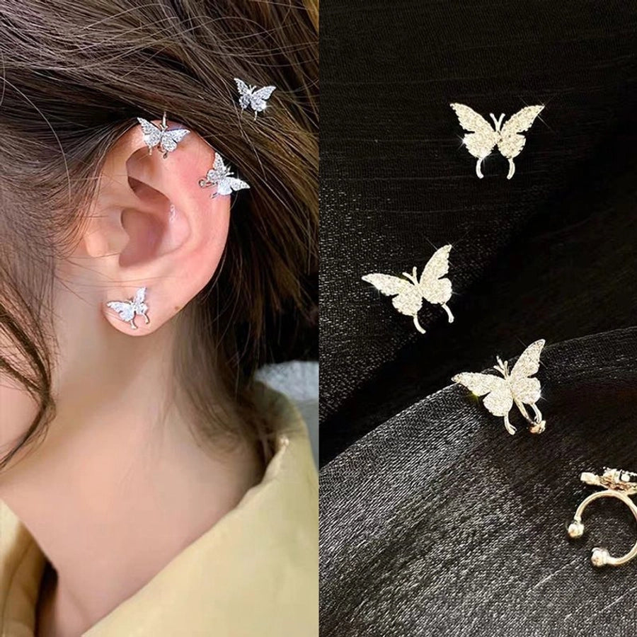 Clips para las orejas con incrustaciones de diamantes artificiales de aleación de mariposa estilo Hada de joyería