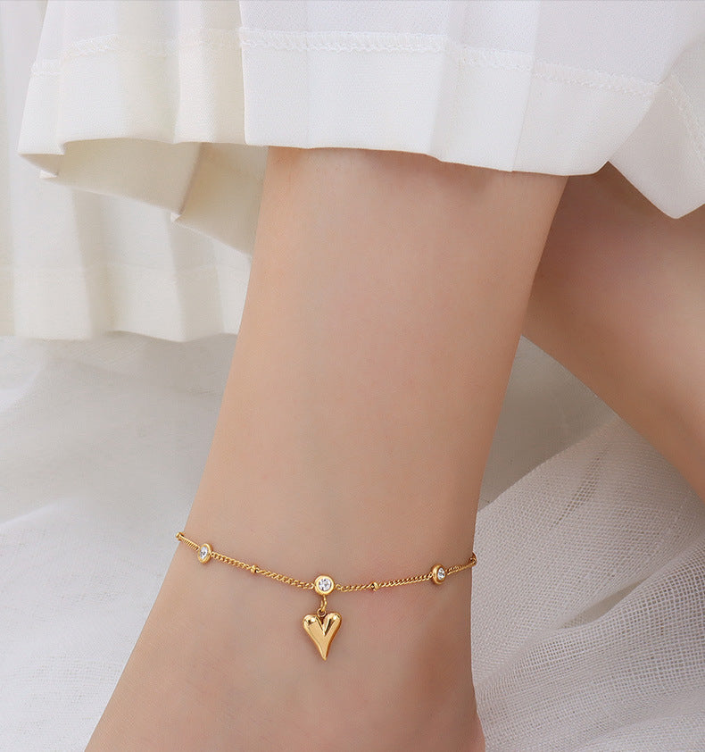 Tobillera con circonita en oro de 18k chapada en acero y titanio con forma de corazón de melocotón