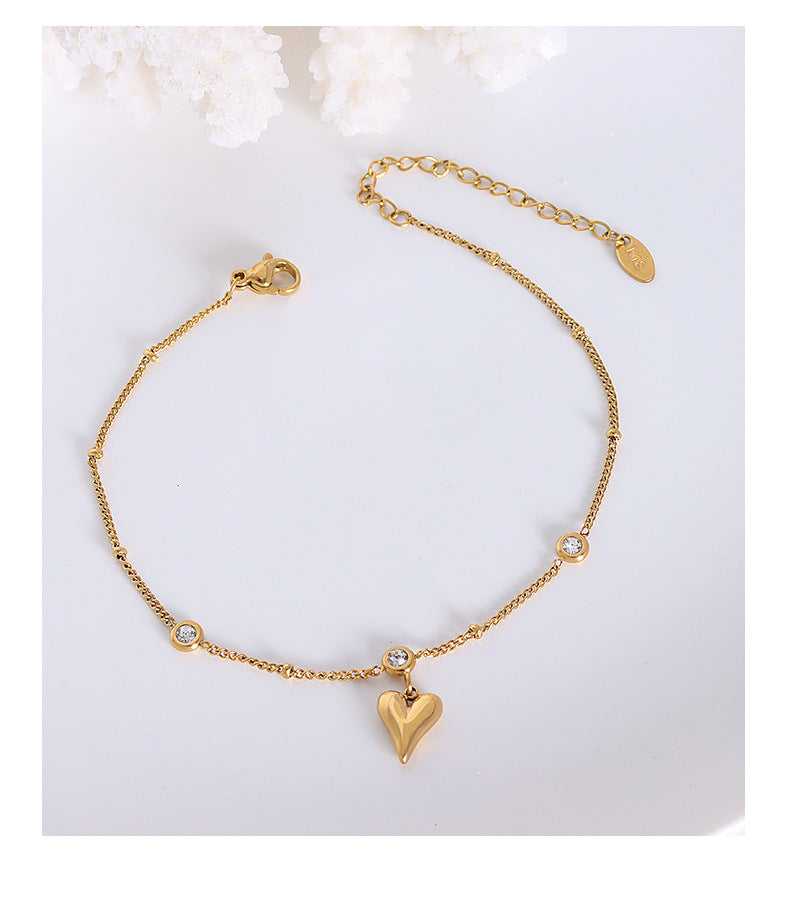 Tobillera con circonita en oro de 18k chapada en acero y titanio con forma de corazón de melocotón