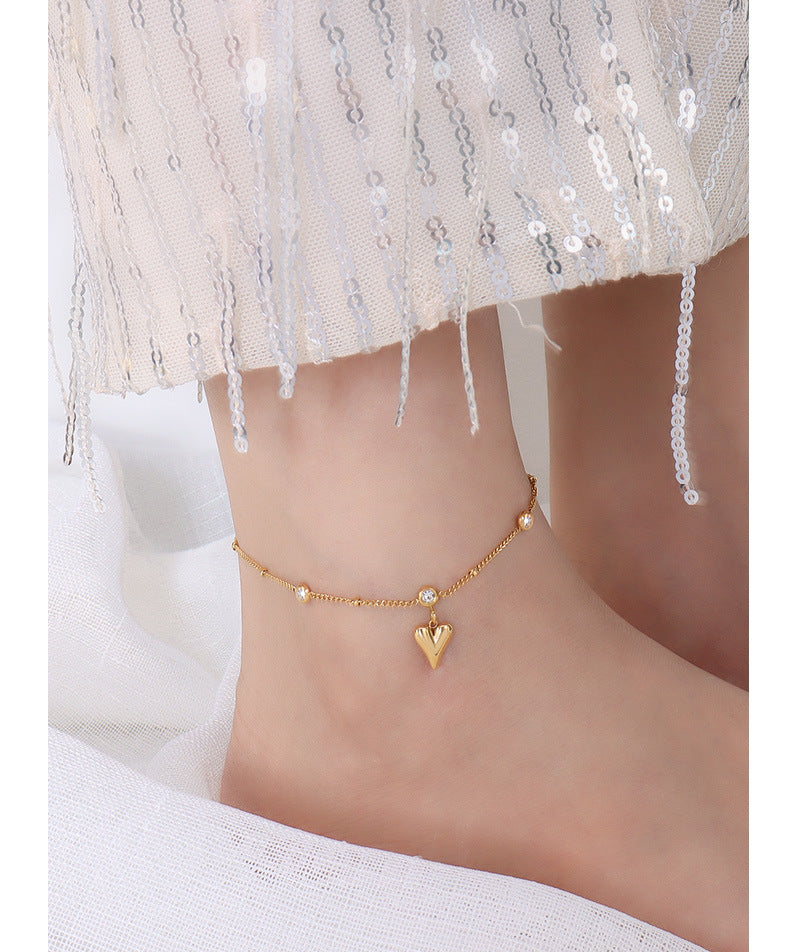 Tobillera con circonita en oro de 18k chapada en acero y titanio con forma de corazón de melocotón