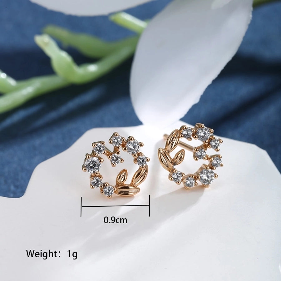 Pendientes de diamantes de imitación de aleación de cobre con incrustaciones de chapado en forma de corazón redondo cruzado elegante estilo de hadas
