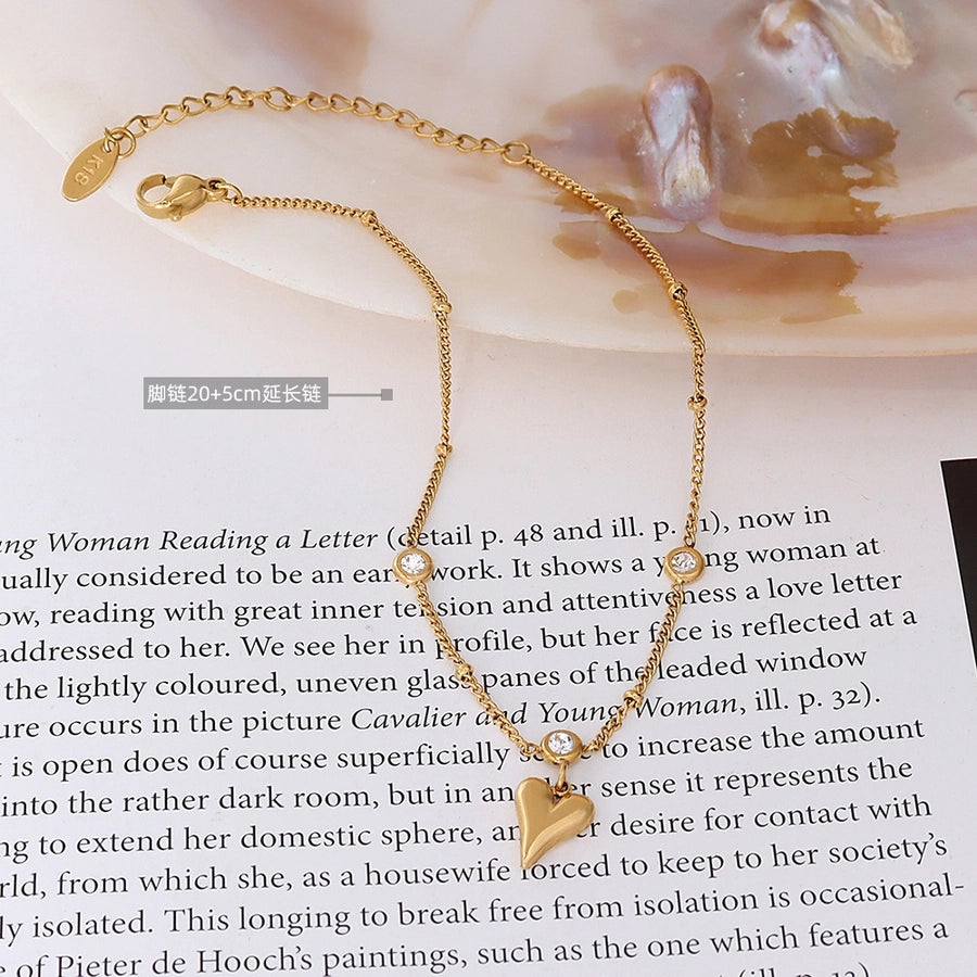 Tobillera con circonita en oro de 18k chapada en acero y titanio con forma de corazón de melocotón