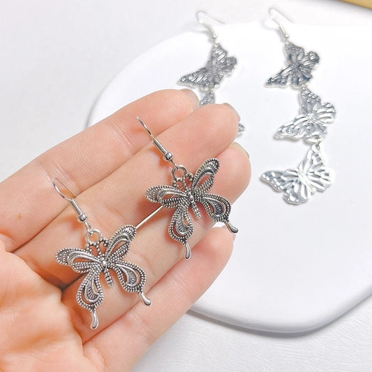 lindos aretes colgantes de metal con forma de mariposa