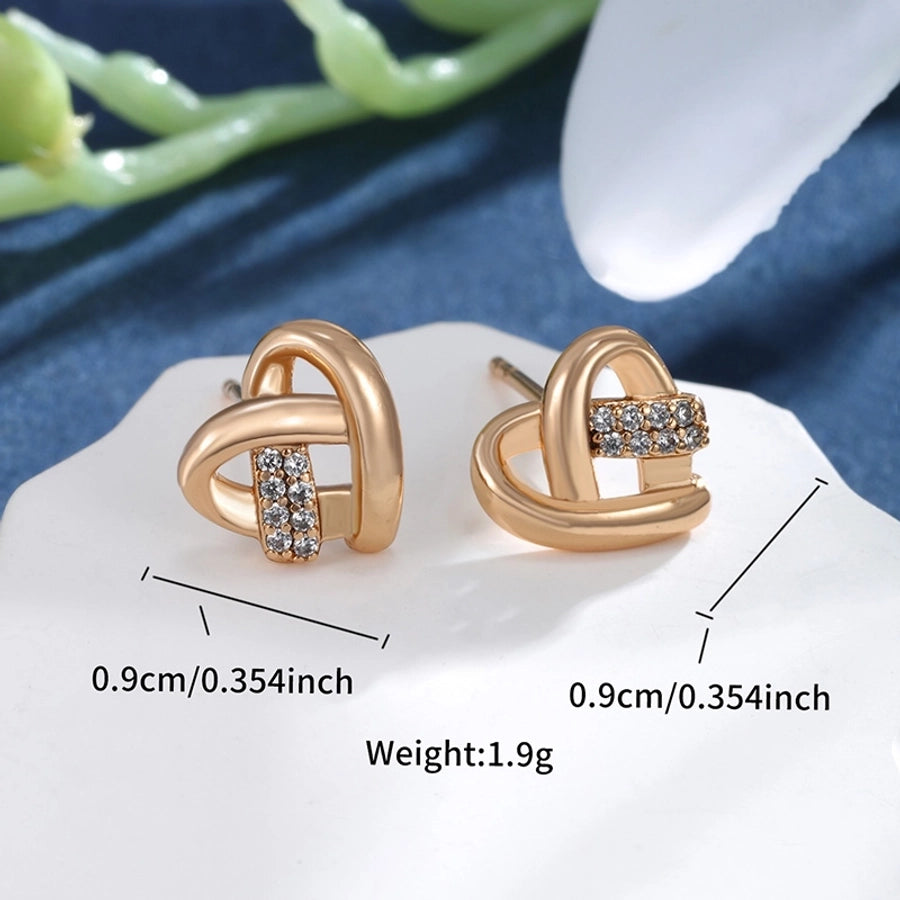 Pendientes de diamantes de imitación de aleación de cobre con incrustaciones de chapado en forma de corazón redondo cruzado elegante estilo de hadas