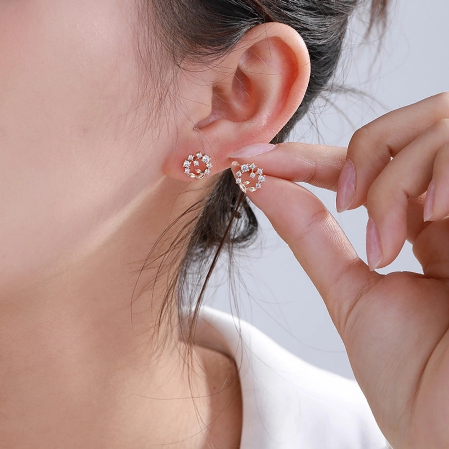 Pendientes de diamantes de imitación de aleación de cobre con incrustaciones de chapado en forma de corazón redondo cruzado elegante estilo de hadas